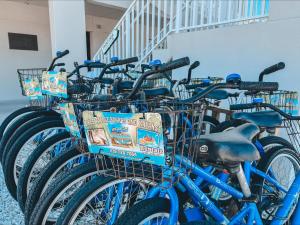 a row of blue bikes parked next to a building at Island Inn in Sanibel