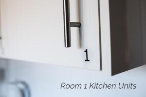a white kitchen cabinet with the number on it at Town House Chantry - With Self Check In and Free Parking - Rooms at ipswichdigs in Ipswich