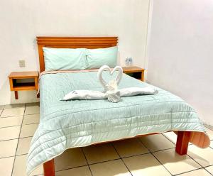 Postel nebo postele na pokoji v ubytování Orquídeas Hotel