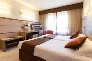Postel nebo postele na pokoji v ubytování NilHotel Florence