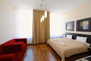 Posteľ alebo postele v izbe v ubytovaní Grand Hotel Trenčin