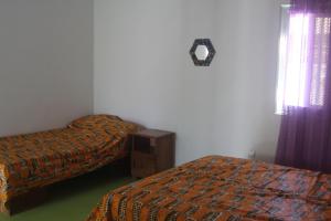 Postel nebo postele na pokoji v ubytování Le Margouillat