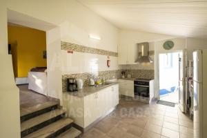 an image of a kitchen in a house at Casa Aconchego by AcasaDasCasas in Mafra