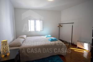 Ένα ή περισσότερα κρεβάτια σε δωμάτιο στο Casa Aconchego by AcasaDasCasas