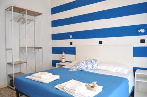 Postel nebo postele na pokoji v ubytování Hotel Susy - Ambienti rinnovati - direttamente su viale Dante e a due passi dal mare