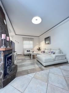 a living room with a couch and a fireplace at Espectacular Bajo Lirio in Calpe