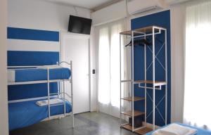 Postel nebo postele na pokoji v ubytování Hotel Susy - Ambienti rinnovati - direttamente su viale Dante e a due passi dal mare