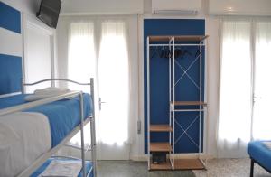 Postel nebo postele na pokoji v ubytování Hotel Susy - Ambienti rinnovati - direttamente su viale Dante e a due passi dal mare