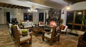 a living room with a couch and a table and chairs at Montañas VIP Family Room in Constanza