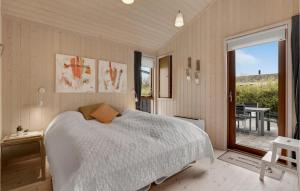 a bedroom with a white bed and a large window at Amazing Home In Sydals With Wifi in Neder Lysabild +18 photos
