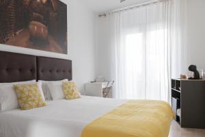 Postel nebo postele na pokoji v ubytování Hostal Puente de Hierro