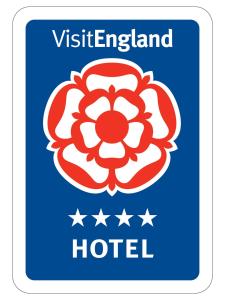 a blue sign with the vietnameland hotel logo at The Randolph Hotel in Southwold