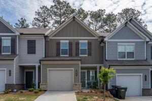 a house with a garage at New Construction 3BR Home Near Chattahoochee River in Norcross