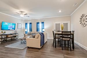 a living room with a couch and a table at New Construction 3BR Home Near Chattahoochee River in Norcross