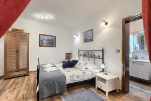 Postel nebo postele na pokoji v ubytování Apartman Pietro
