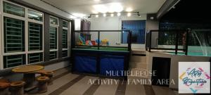 a bathroom with a swimming pool in a house at Artsy Staycation in Melaka
