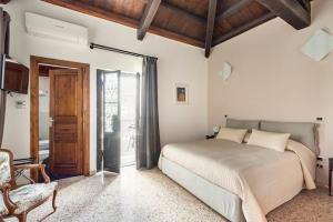 Postel nebo postele na pokoji v ubytování Palazzo Candida B&B