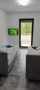 Katil atau katil-katil dalam bilik di Apartament Świdnica