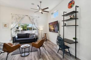 a living room with a couch and chairs at The Gregory: 2 Bed/1 Bath Guesthouse in Phoenix