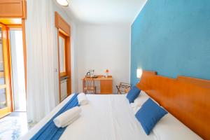Łóżko lub łóżka w pokoju w obiekcie Hotel San Pietro