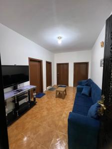 TV a/nebo společenská místnost v ubytování Petra Gold Inn Apartments + 9 fotografií