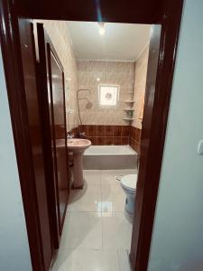 Koupelna v ubytování Petra Gold Inn Apartments