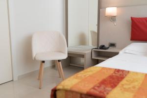 Łóżko lub łóżka w pokoju w obiekcie Hotel San Pietro