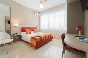 Łóżko lub łóżka w pokoju w obiekcie Hotel San Pietro