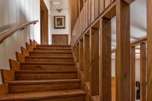 a wooden staircase in a house with wooden floors at Hotel Hontoria in Hontoria
