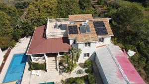 an aerial view of a house with solar panels on it at Pomos Harbourbiew Villa in Pomos