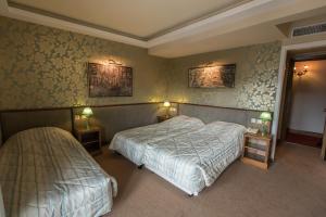 Katil atau katil-katil dalam bilik di Anesis Hotel