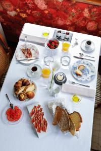 a white table with breakfast foods on it at Hotel Hontoria in Hontoria