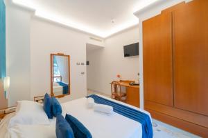 Łóżko lub łóżka w pokoju w obiekcie Hotel San Pietro