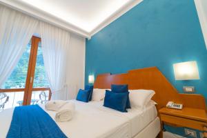 Łóżko lub łóżka w pokoju w obiekcie Hotel San Pietro