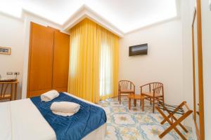 Łóżko lub łóżka w pokoju w obiekcie Hotel San Pietro