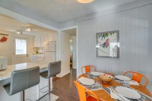 a kitchen and dining room with a table and chairs at Pet-Friendly Englewood Escape about 6 Mi to Denver! in Englewood