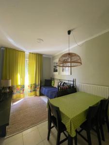 a living room with a table and a couch at Lefkas Marine Apartment in Lefkada