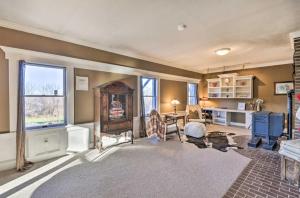 a large living room with a table and a desk at Hilltop Retreat & Spa in Tully +28 photos