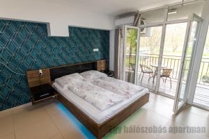 Posteľ alebo postele v izbe v ubytovaní Tisza Gyöngye Apartmanok