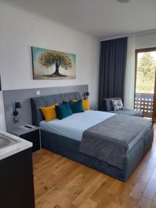 Postel nebo postele na pokoji v ubytování Guest House Vila Lujza