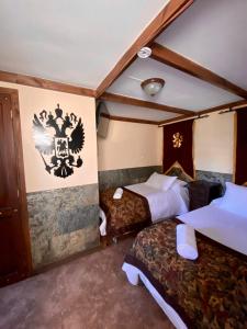 Łóżko lub łóżka w pokoju w obiekcie Castillo Medieval