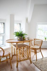 a dining room with a table and two chairs at Neighbourhood Bedrooms in Cardiff