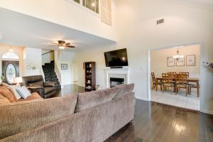 a living room with a couch and a dining room at Hot Springs Vacation Rental with Pool Access and Deck! in Hot Springs