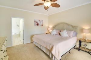 a bedroom with a bed and a ceiling fan at Hot Springs Vacation Rental with Pool Access and Deck! in Hot Springs