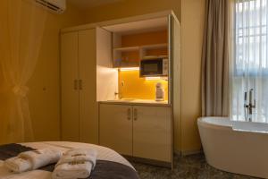 a bathroom with a tub and a sink and a bath tub at Hidden Bank: Pearls in Plovdiv