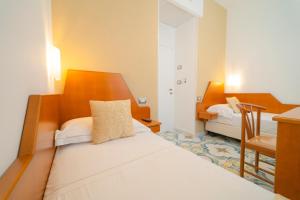 Łóżko lub łóżka w pokoju w obiekcie Hotel San Pietro