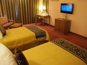 TV a/nebo společenská místnost v ubytování Hotel Grand Continental Kuching