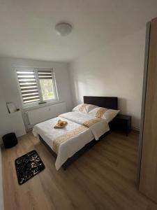 a bedroom with a bed and a window at Apartmán Miriam in Nitra