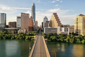 a bridge over a river in a city with buildings at Condo Near Downtown Austin - 2br in Austin
