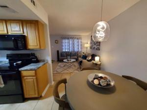 a kitchen and living room with a table and a dining room at Condo Near Downtown Austin - 2br in Austin